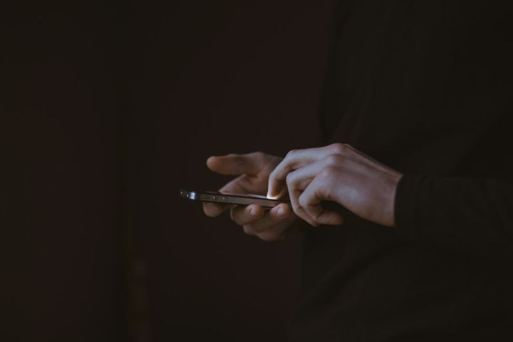 Digital Business - silhouette photo of person holding smartphone