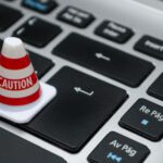 Data Privacy - White Caution Cone on Keyboard