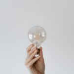 Efficient Workflows - Anonymous female showing light bulb